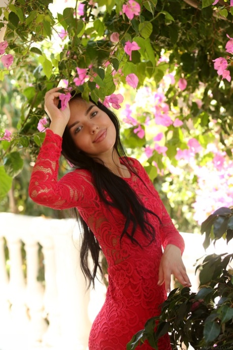 Raven-haired teen with hot lips Venice Lei strips her lace dress & poses naked