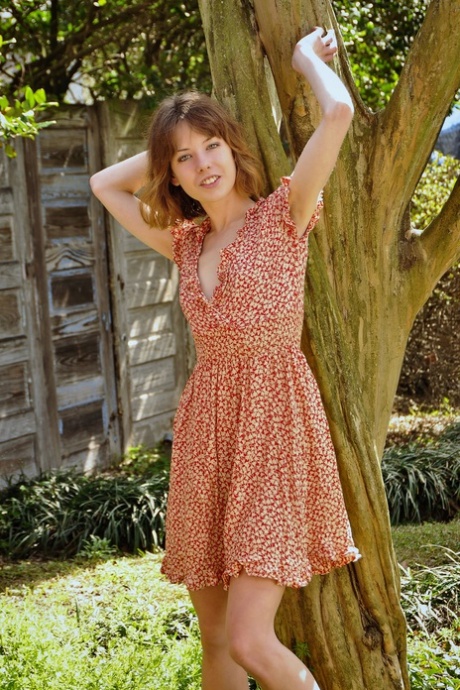 Naughty teen Emily Windsor shows off her skinny naked body outdoors
