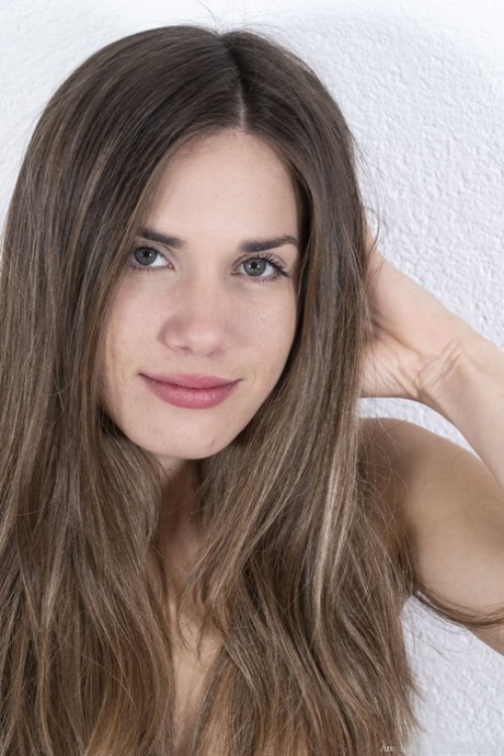 Beautiful American Treplev gets naked and massages her furry snatch